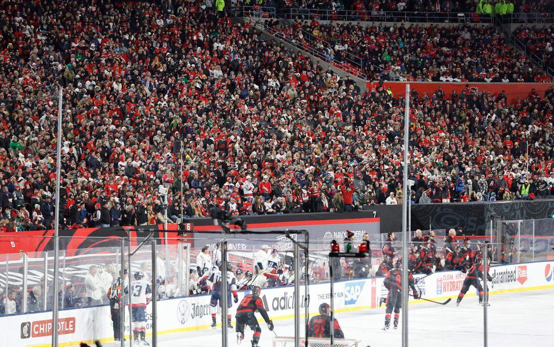 Fans watch during the second period of the NHL Stadium Series game between the Carolina Hurricanes and the Washington Capitals at Carter-Finley Stadium in Raleigh, N.C., Saturday, Feb. 18, 2023.