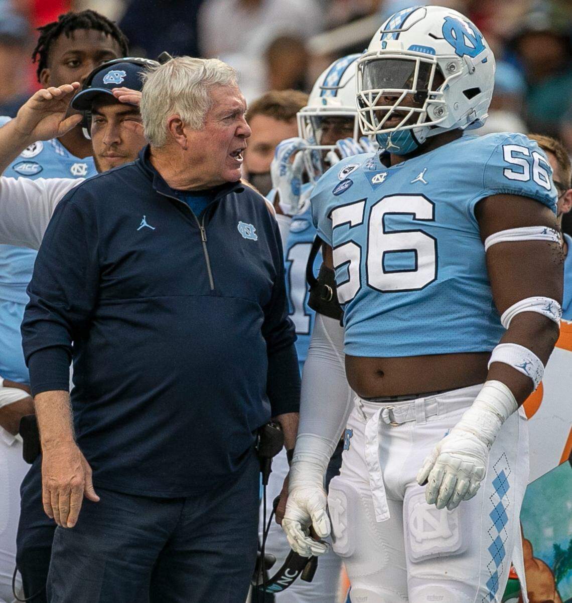 North Carolina coach Mack Brown has a word with Tomari Fox (56) after he was called for an unsportsmanlike, 15-yard penalty in the third quarter against Florida State on Saturday, October 9, 2021at Kenan Stadium in Chapel Hill, N.C.