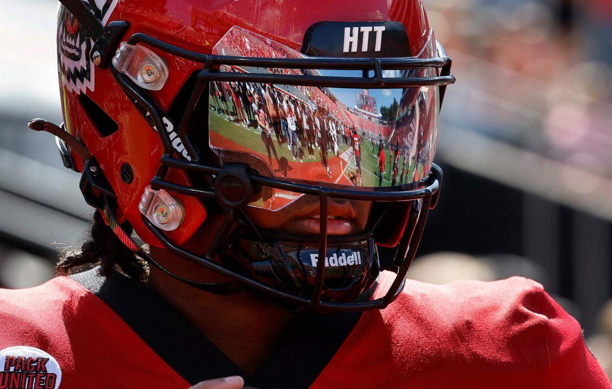 N.C. State quarterback MJ Morris (7) warms up before the Wolfpack’s game against Marshall at Carter-Finley Stadium in Raleigh, N.C., Saturday, Oct. 7, 2023.