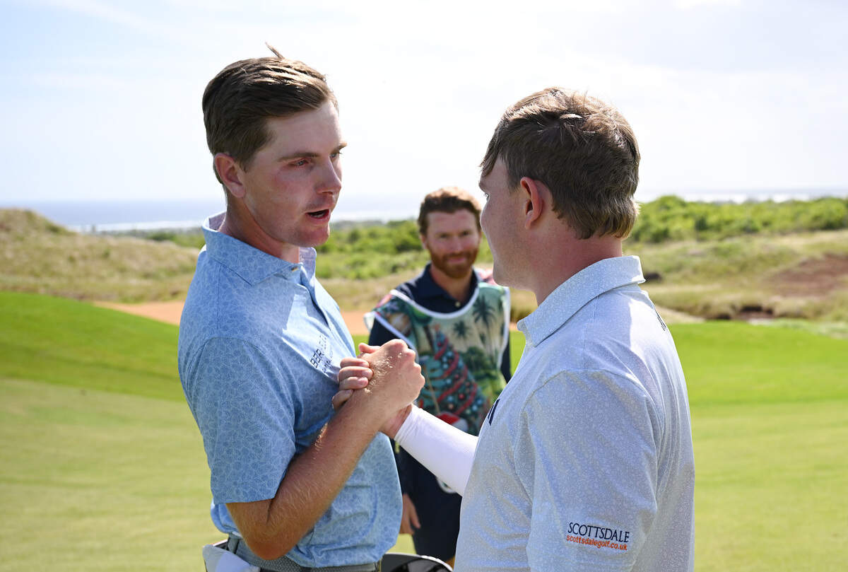 Ryan Gerard of the United States and Jayden Schaper of South Africa shake hands following the second playoff hole on day four of the AfrAsia Bank Mauritius Open 2026 at Heritage La Reserve Golf Club on Dec. 21, 2025 in Bel Ombre, Mauritius.