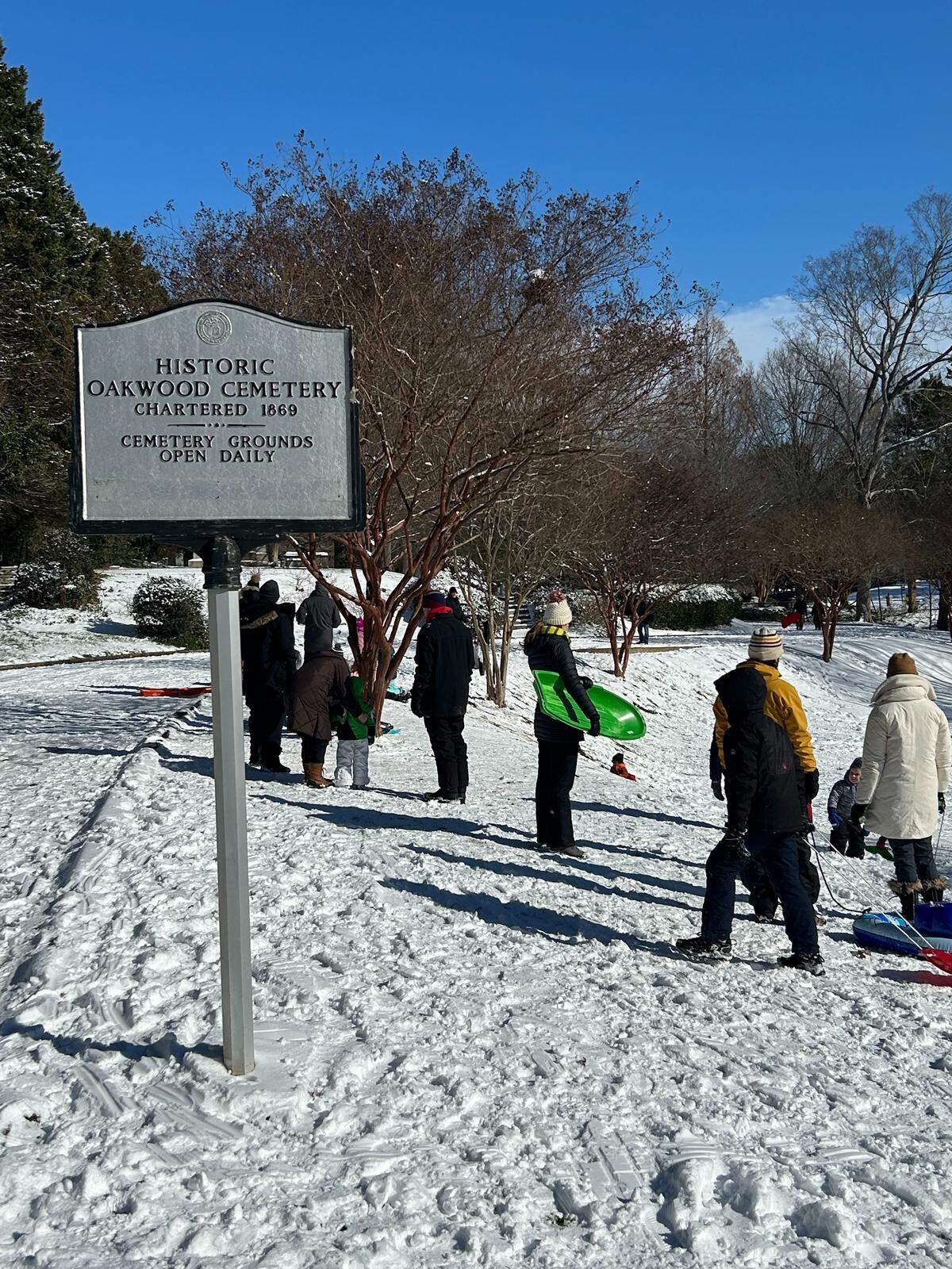 Sledders opt for Raleigh’s Historic Oakwood Cemetery near downtown