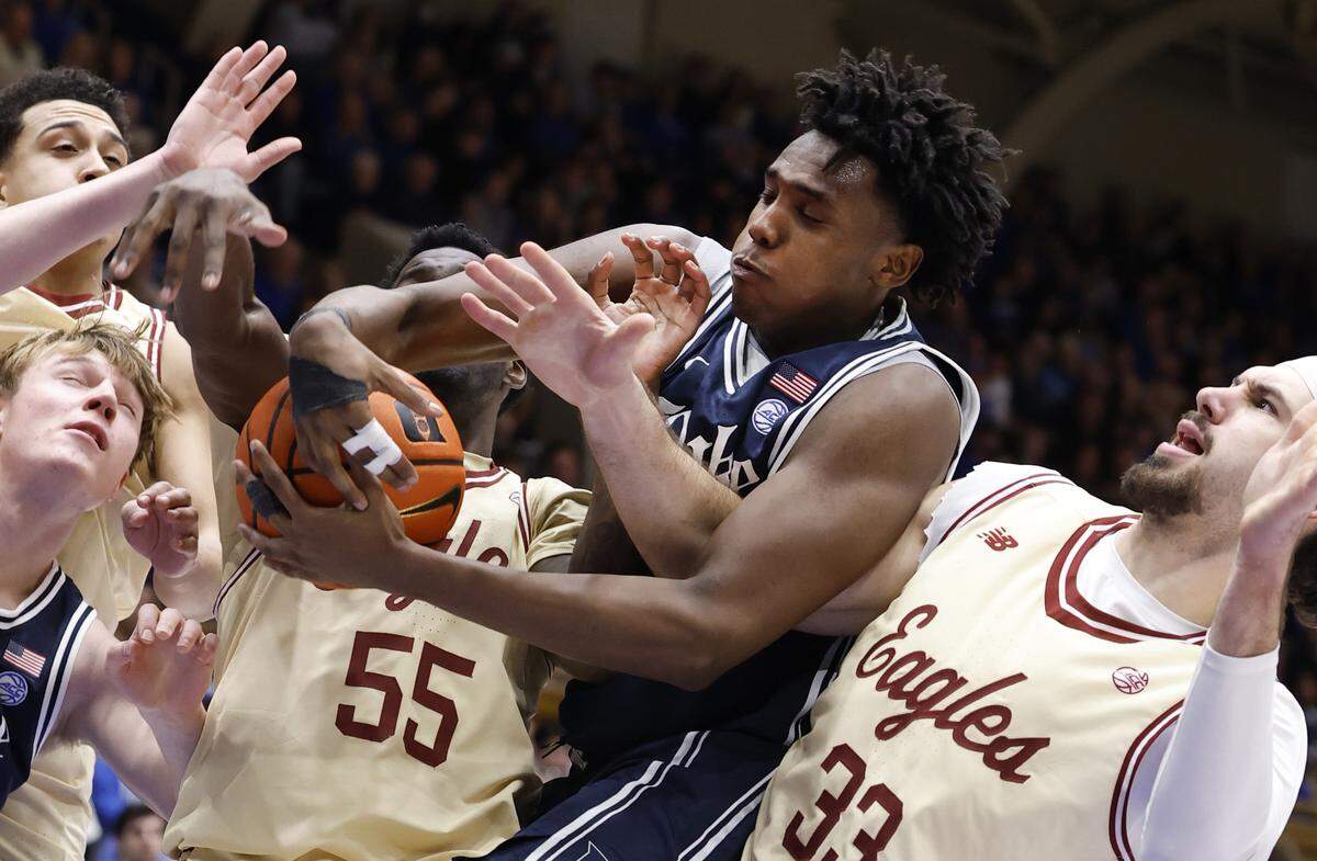 Duke’s Patrick Ngongba II (21) pulls in the rebound from Boston College's Boden Kapke (33) during the second half of Duke’s 67-49 victory over Boston College at Cameron Indoor Stadium in Durham, N.C., Tuesday, Feb. 3, 2026.