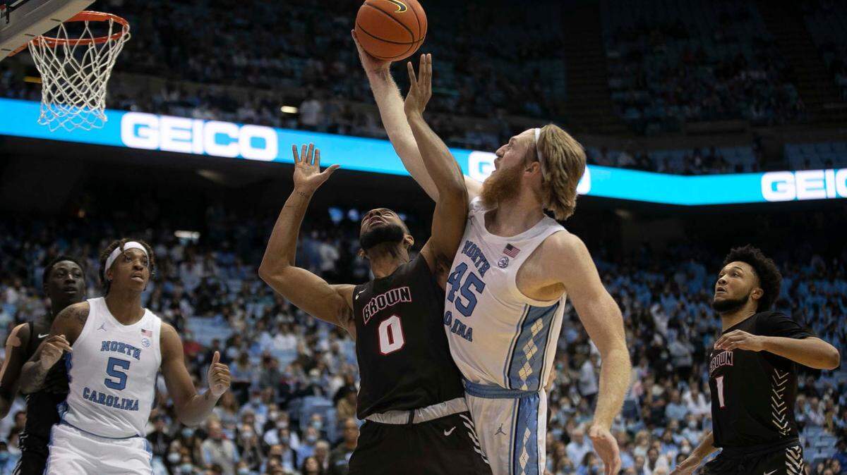 North Carolina’s Brady Manek (45) works to secure an offensive rebound against Brown’s David Mitchell (0) during the second half on Friday, November 12, 2021 at the Smith Center in Chapel Hill, N.C.