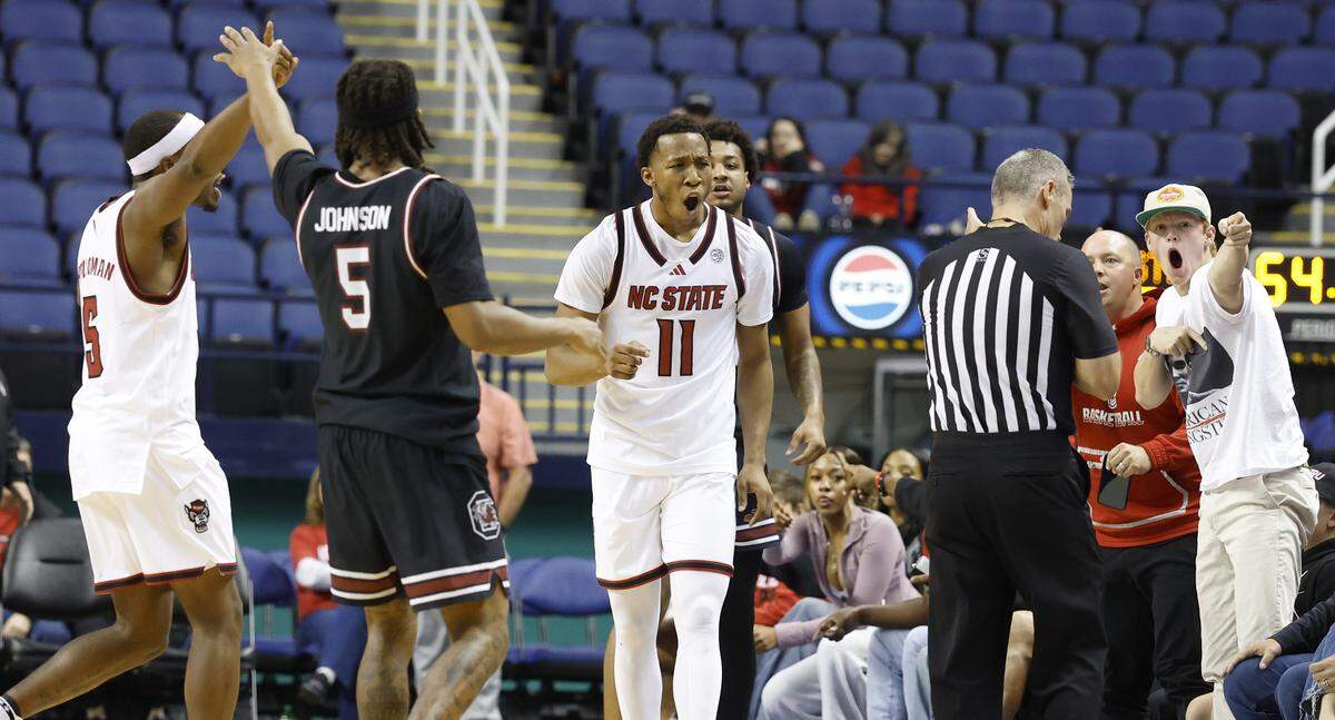 N.C. State's Quadir Copeland (11) reacts after the Wolfpack couldn’t pull in the steal in the second half of N.C. State’s 88-86 exhibition victory over South Carolina at the First Horizon Coliseum in Greensboro, N.C., Sunday Oct. 26, 2025.