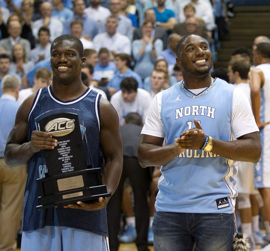 North Carolina football players Shakeel Rashad, left and Marquise Williams are recognized during the North Carolina vs. Maryland basketball game on Tuesday, December 1, 2015 at the Smith Center in Chapel Hill, N.C.