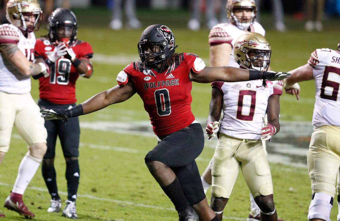 N.C. State defensive end Terrell Dawkins (0) celebrates after sacking Florida State quarterback Tate Rodemaker during the first half of N.C. State’s game against Florida State at Carter-Finley Stadium in Raleigh, N.C., Saturday, Nov. 14, 2020.