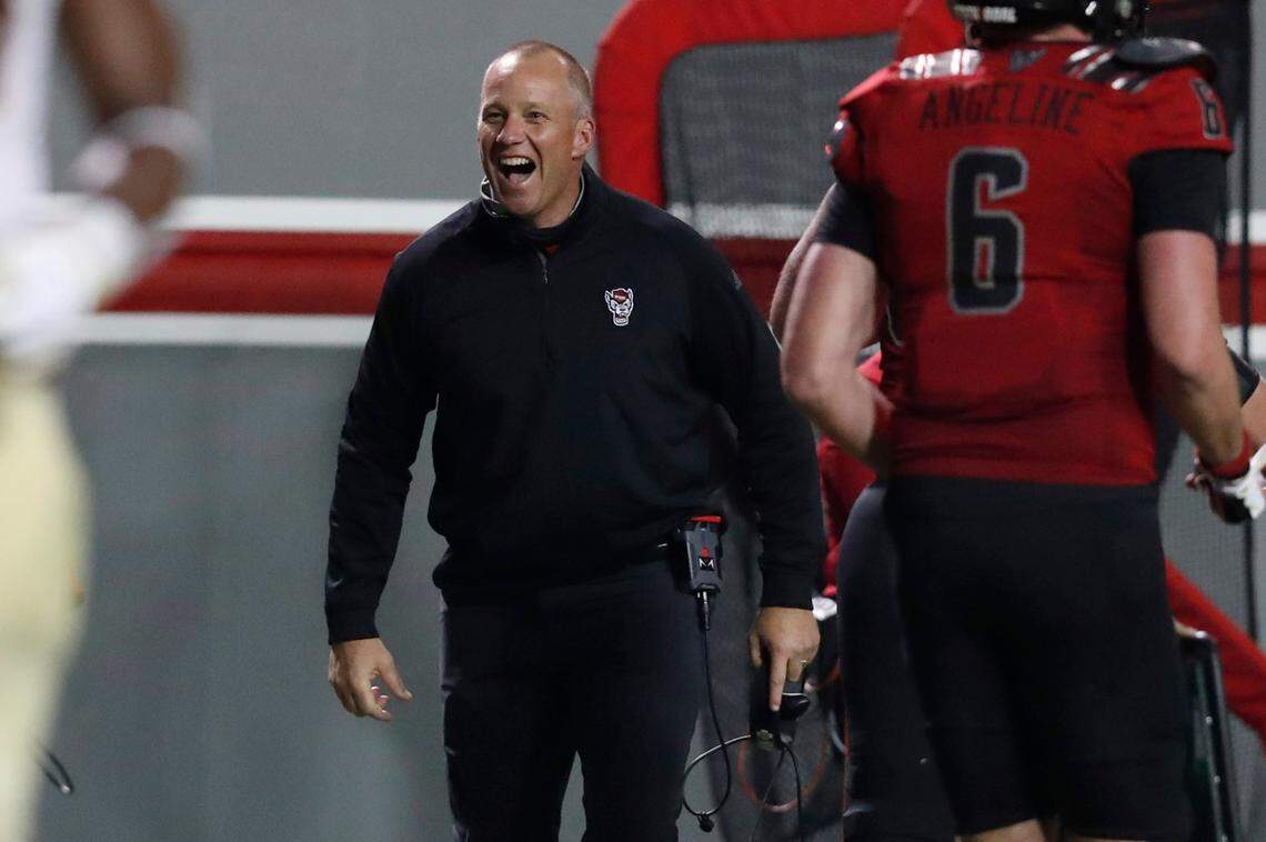 N.C. State head coach Dave Doeren celebrates after a Wolfpack touchdown during the second half of N.C. State’s 38-22 victory over Florida State at Carter-Finley Stadium in Raleigh, N.C., Saturday, Nov. 14, 2020.