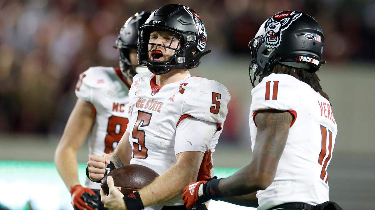 N.C. State quarterback Brennan Armstrong (5) celebrates after a long run during the second half of N.C. State’s 35-28 victory over Virginia Tech at Lane Stadium in Blacksburg, VA, Saturday, Nov. 18, 2023.