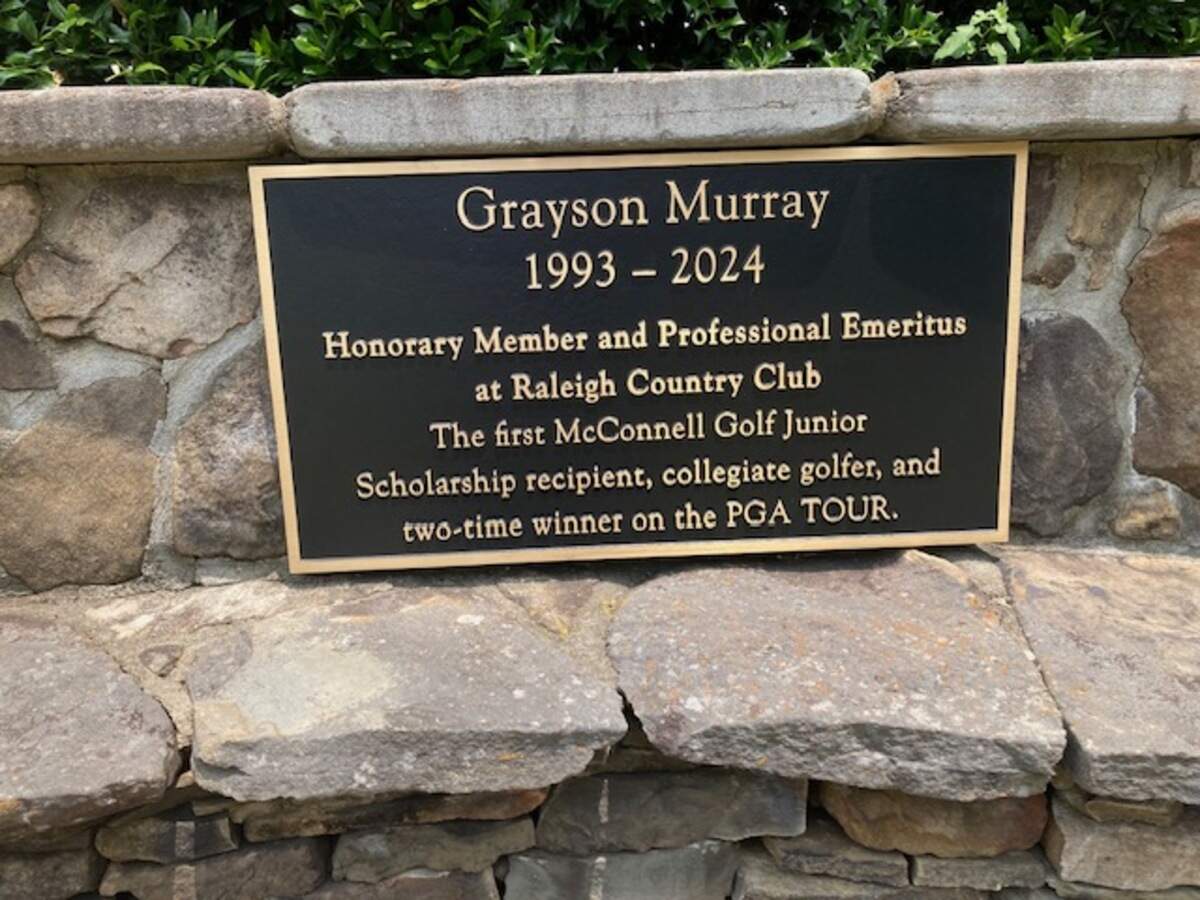 A plaque honoring the late Grayson Murray, a former PGA Tour winner who died in 2024, has been placed behind the first tee at Raleigh Country Club, in Raleigh, NC. Chip Alexander.