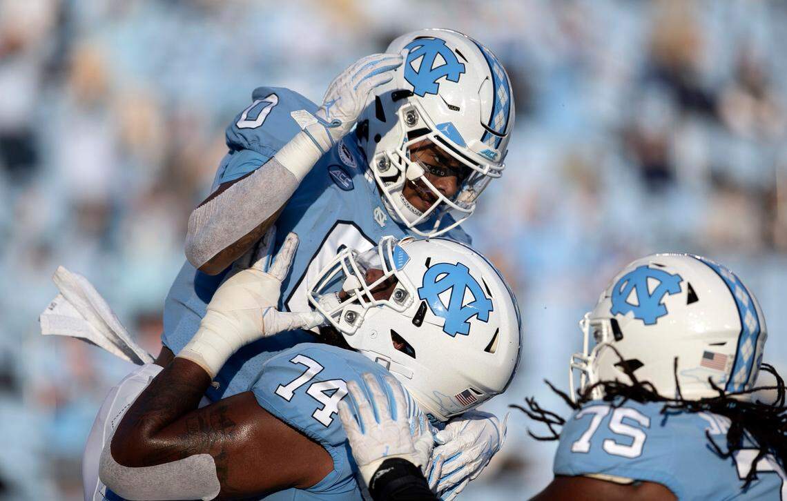 North Carolina’s Emery Simmons (0) celebrates after scoring on a six-yard pass reception from quarterback Sam Howell in the first quarter against Notre Dame on Friday, November 27, 2020 at Kenan Stadium in Chapel Hill, N.C.