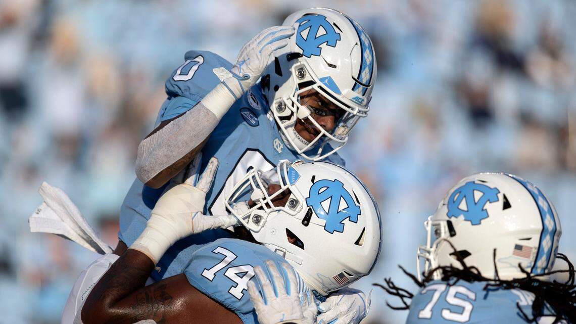 North Carolina’s Emery Simmons (0) celebrates after scoring on a six-yard pass reception from quarterback Sam Howell in the first quarter against Notre Dame on Friday, November 27, 2020 at Kenan Stadium in Chapel Hill, N.C.