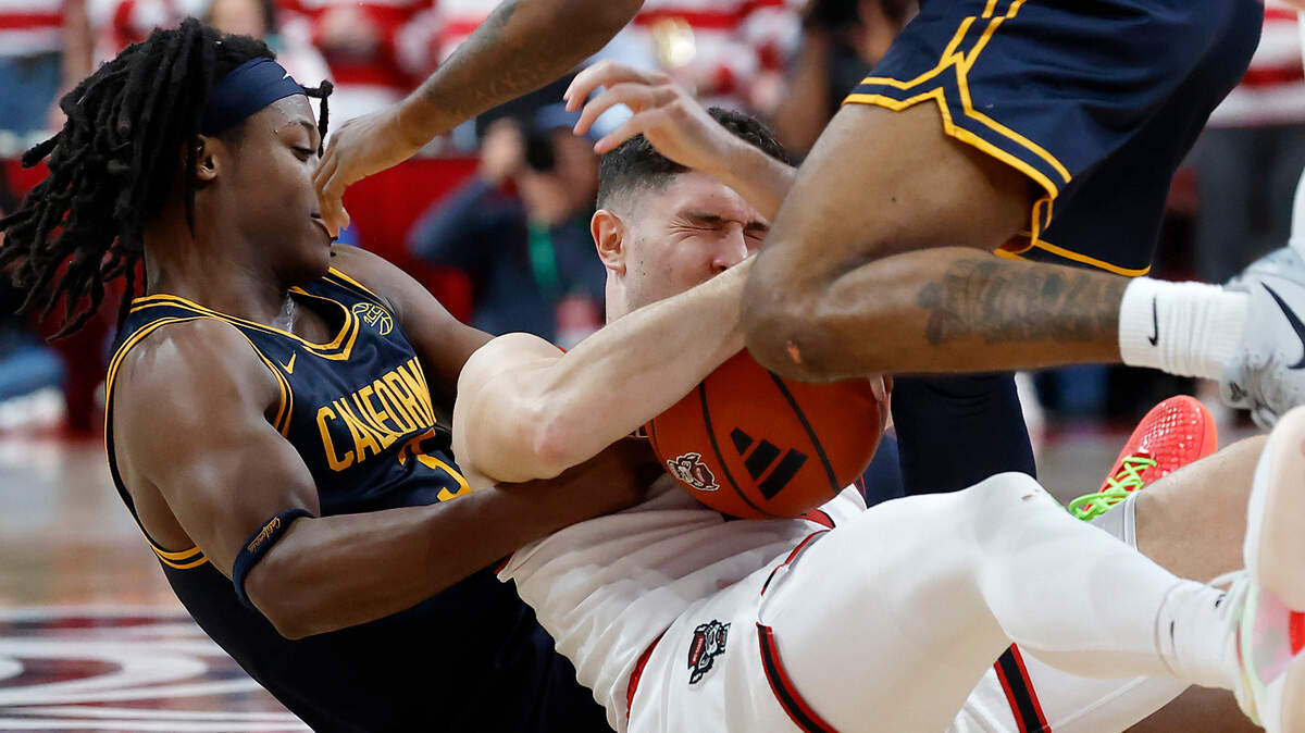 N.C. State’s Michael O’Connell gets tied up with California’s DJ Campbell and Jovan Blacksher Jr. during the second half of the Wolfpack’s 65-62 loss on Saturday, Jan. 18, 2025, at Lenovo Center in Raleigh, N.C.