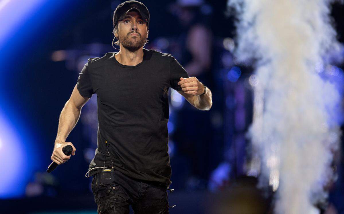 Enrique Iglesias runs down the stage as he opens “The Trilogy Tour” at Raleigh, N.C.’s PNC Arena, Thursday night, Feb. 29, 2024.