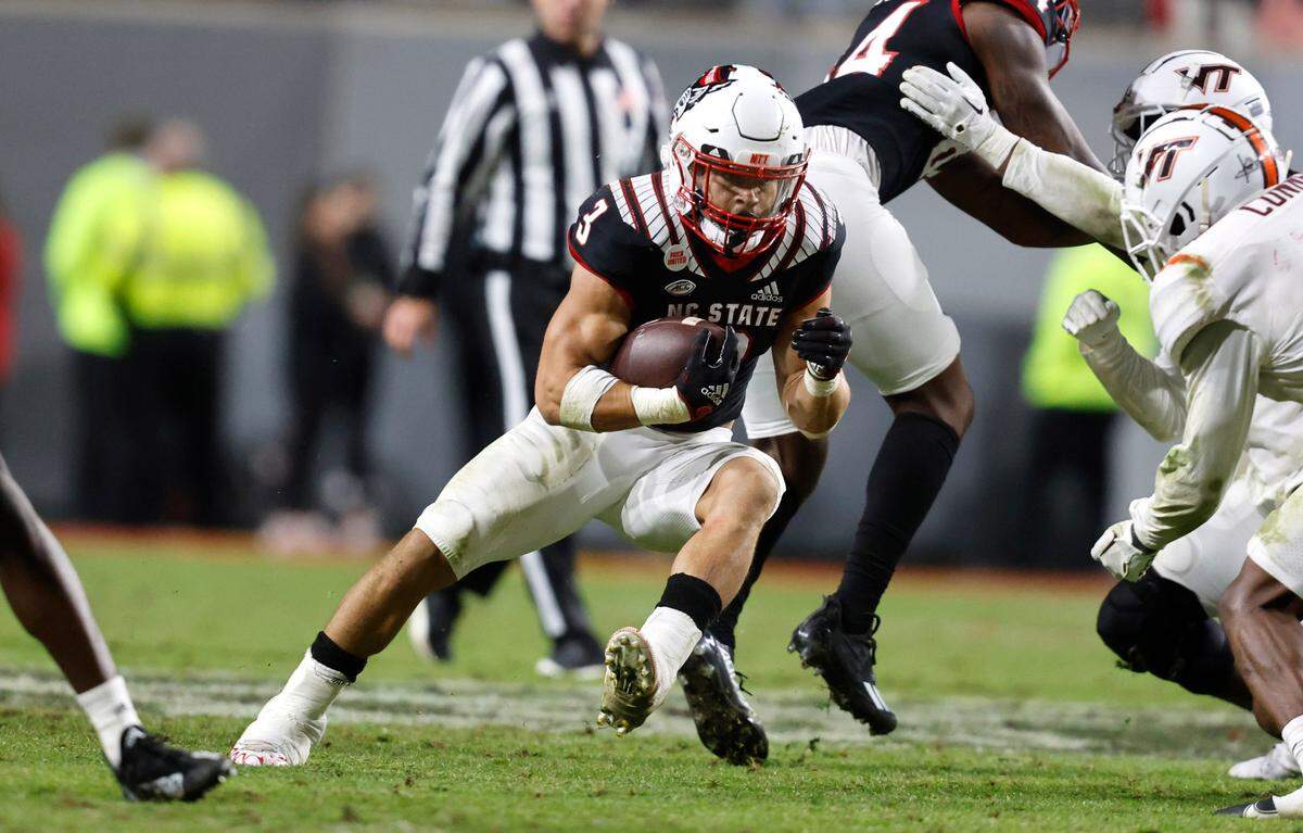 N.C. State running back Jordan Houston (3) gains yards during the second half of N.C. State’s 22-21 victory over Virginia Tech at Carter-Finley Stadium in Raleigh, N.C., Thursday, Oct. 27, 2022.