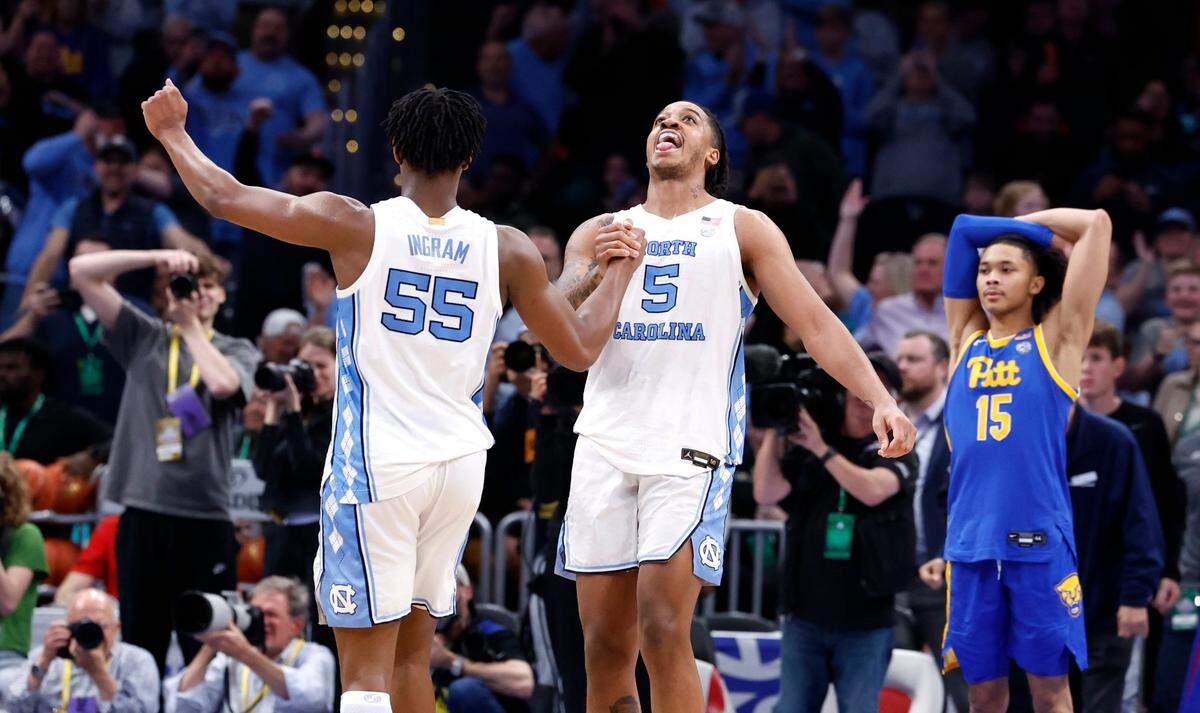North Carolina’s Harrison Ingram (55) and Armando Bacot (5) celebrate as time run out in UNC’s 72-65 victory over Pitt in the semifinals of the 2024 ACC Men’s Basketball Tournament at Capital One Arena in Washington, D.C., Friday, March 15, 2024.