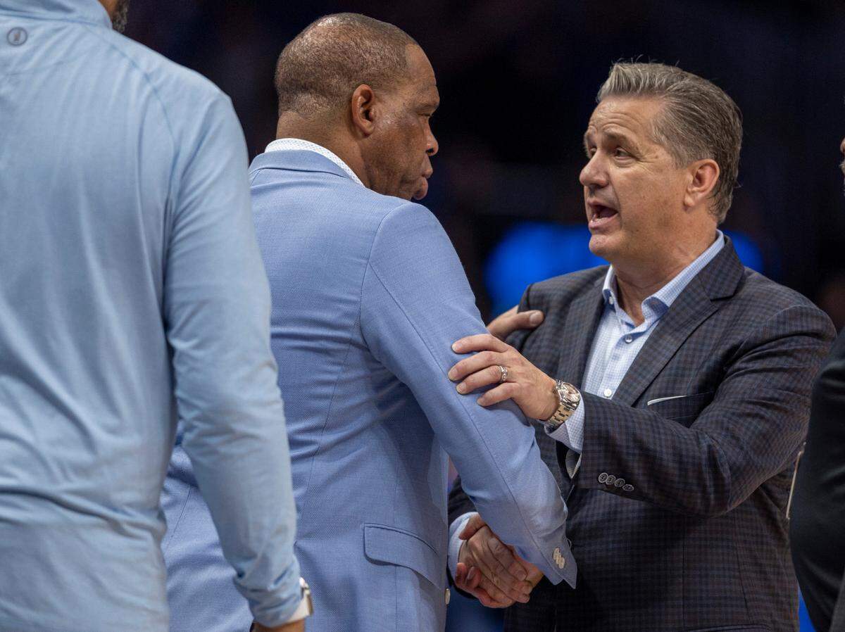 Kentucky coach John Calipari congratulates North Carolina coach Hubert Davis following the Wildcat’s 87-83 victory on Saturday, December 16, 2023 at State Farm Arena in Atlanta, Georgia.