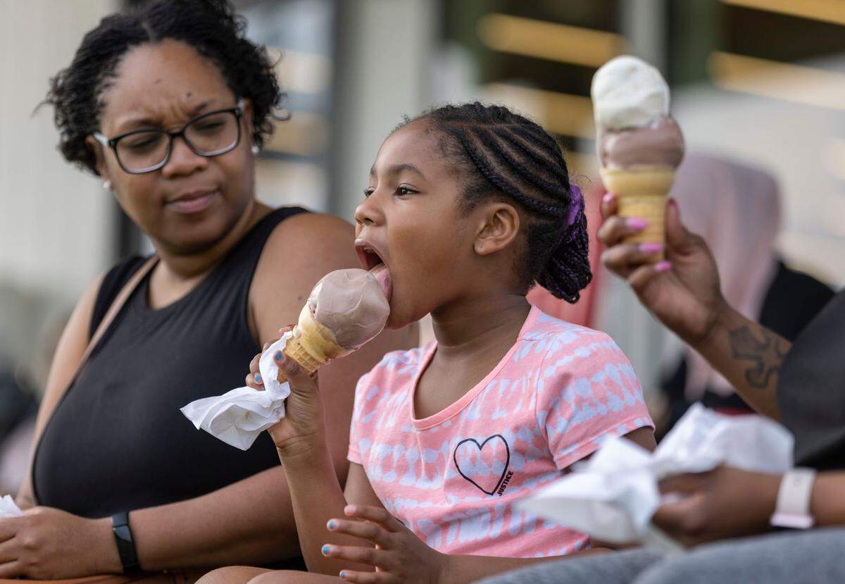 Seven-year-old Madison Bryant of Raleigh enjoys a cone of ice cream. File photo. July 5, 2022.