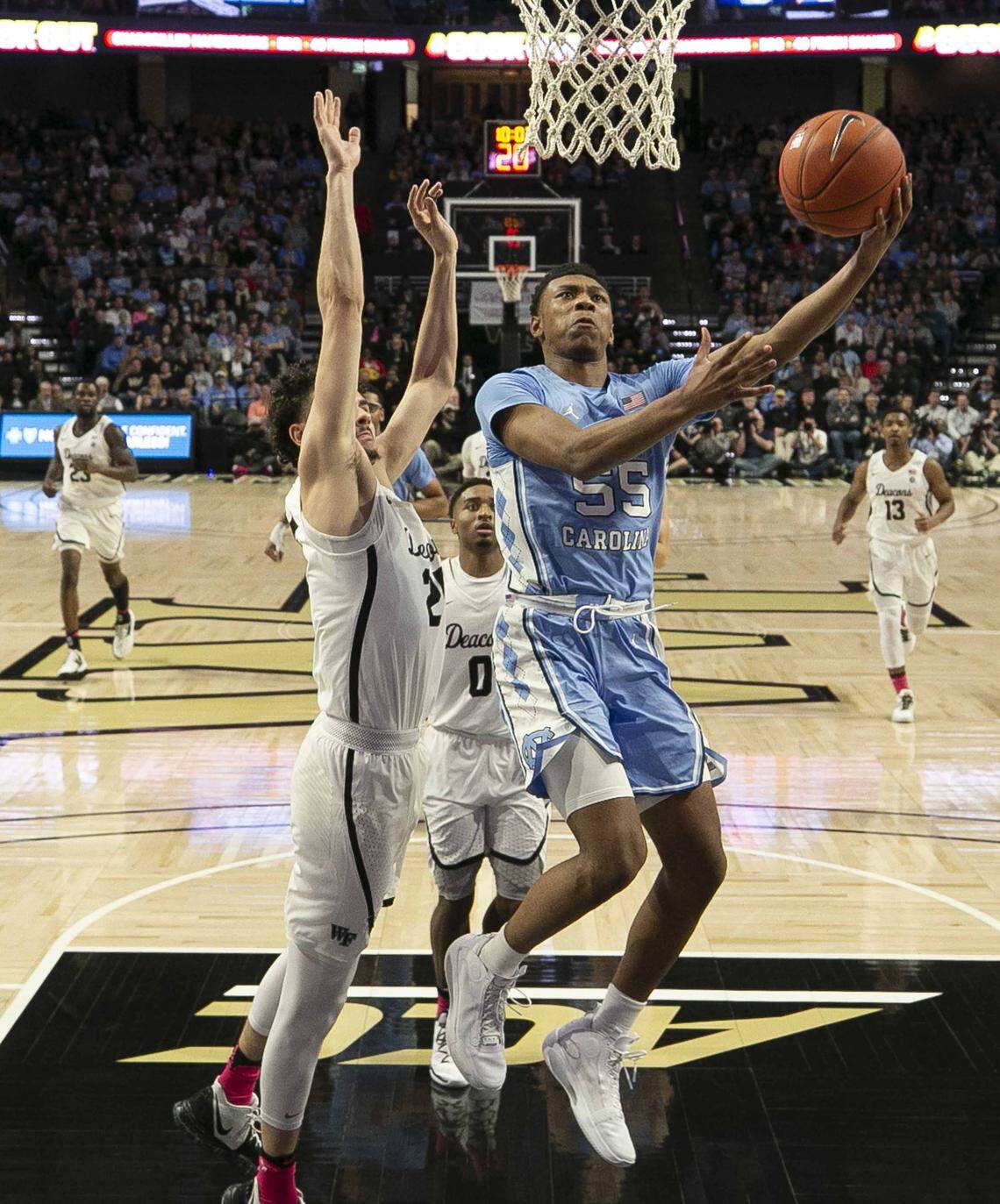 North Carolina’s Christian Keeling (55) drives to the basket against Wake Forest’s Ismael Massoud (25) during the second half on Tuesday, February 11, 2020 at Lawrence Joel Coliseum in Winston-Salem, N.C. Keeling lead North Carolina with 15 points.