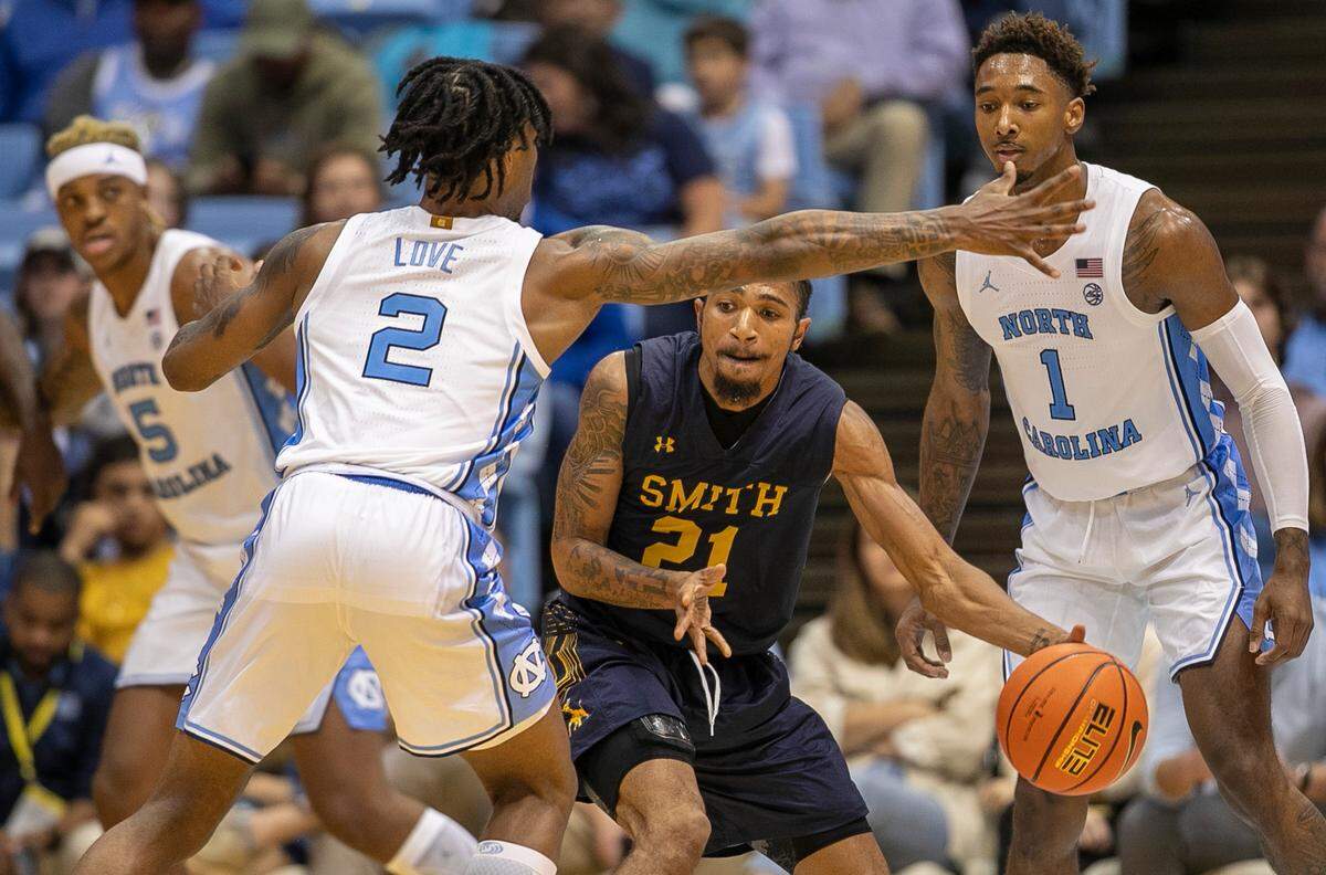 North Carolina’s Caleb Love (2) traps Johnson C. Smith’s Nilous Hodge Jr. (21) in the second half during an exhibition game on Friday, October 28, 2022 at the Smith Center in Chapel Hill, N.C.