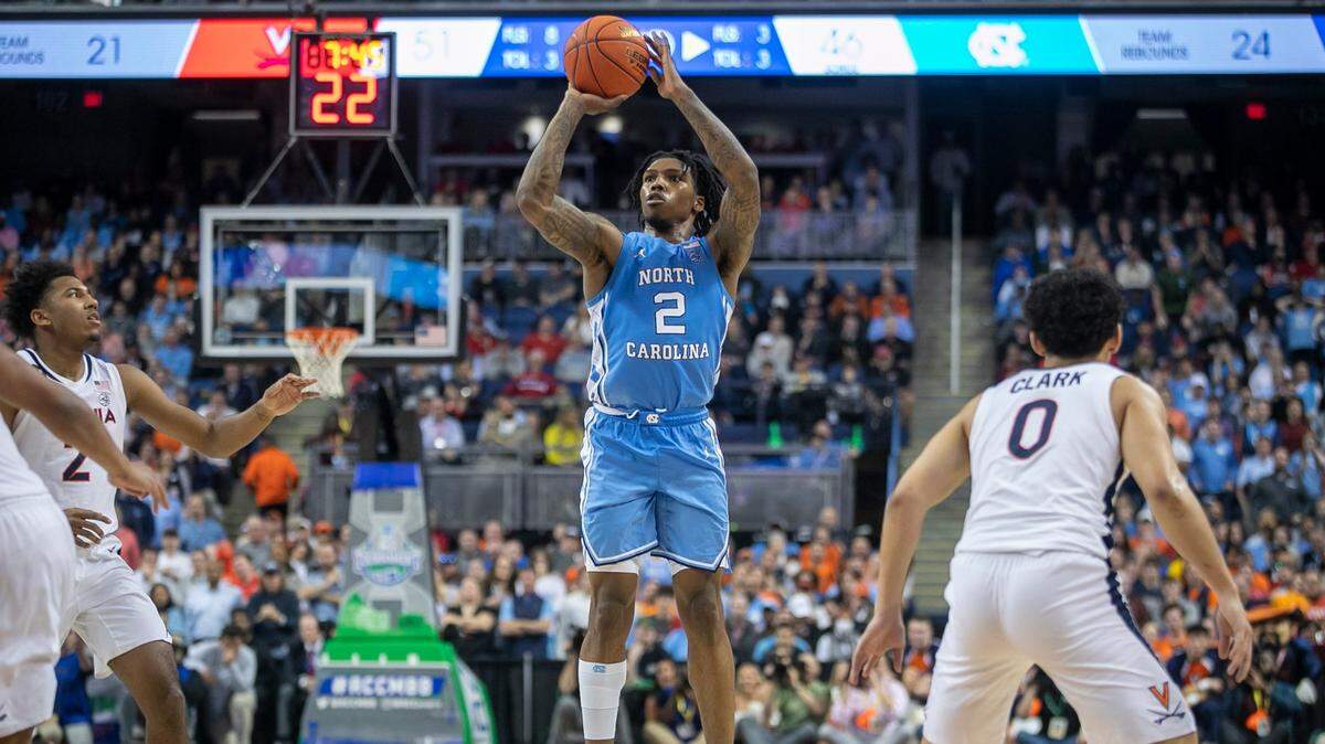 North Carolina’s Caleb Love (2) launches a three point attempt in the second half against Virginia during the ACC Tournament on March 9, 2023, at the Greensboro Coliseum in North Carolina.