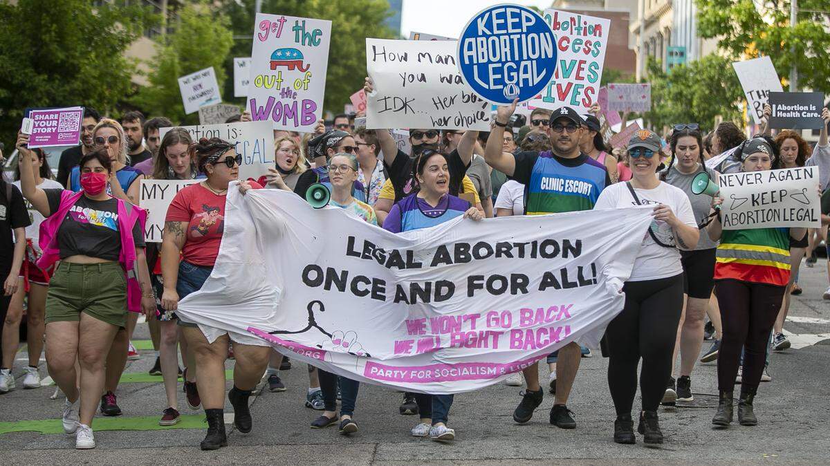 Hundreds of demonstrators marched down Salisbury Street in Raleigh on May 3, 2022, calling for the preservation of abortion rights after a leaked draft opinion of a Supreme Court decision indicated the court could be poised to overturn Roe v. Wade.