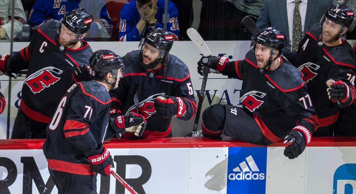 Carolina Hurricanes defenseman Brady Skjei (76) is greeted by teammate Tony DeAngelo (77) after scoring the game winning goal on a power play late in the third period to secure a 4-3 victory over the New York Rangers during Game 4 in the second round of the 2024 Stanley Cup playoffs on Saturday, May 11, 2024 at PNC Arena, in Raleigh N.C.