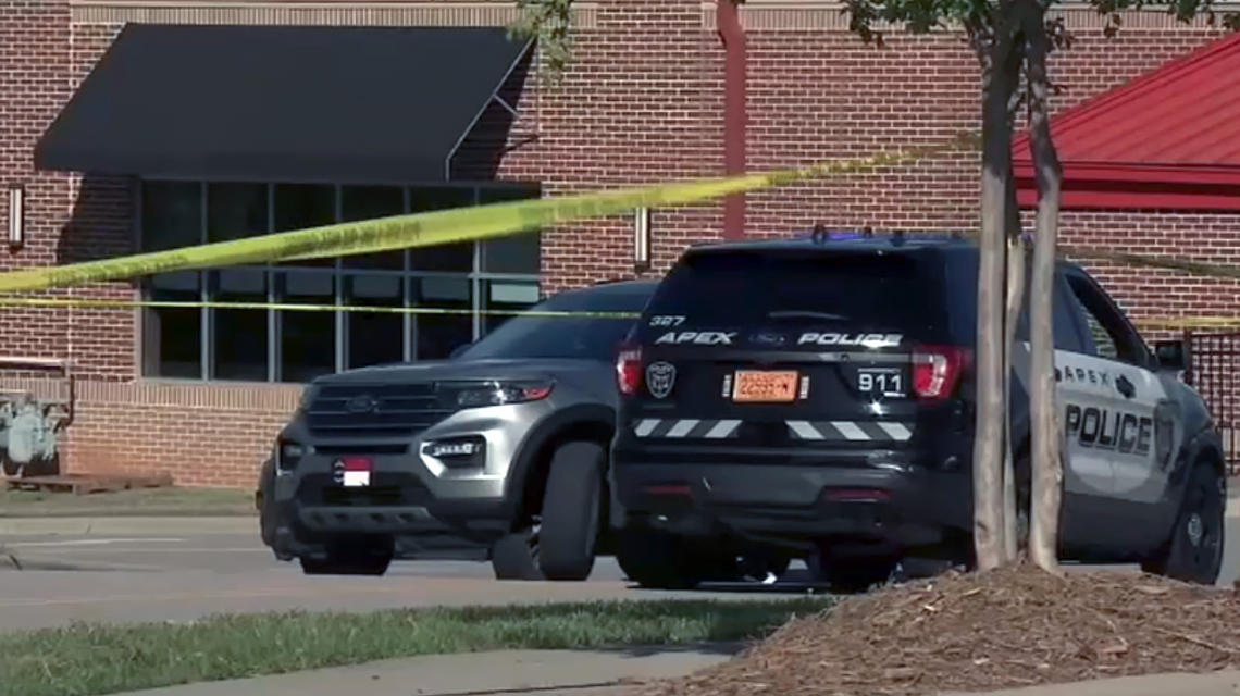 The scene of a shooting in Apex, NC on Tuesday, April 11, 2023. SBI agent Denzel Ward shot and killed 18-year-old Dayve Sanchez after Sanchez allegedly shoplifted ammunition. A stolen AR-15 was found at the scene.