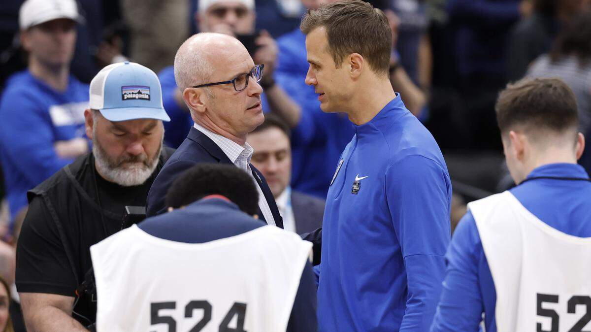 Duke head coach Jon Scheyer greets UConn head coach Dan Hurley before their game in the NCAA Men’s Tournament East Regional Final at Capital One Arena in Washington, D.C., Sunday, March 29, 2026.