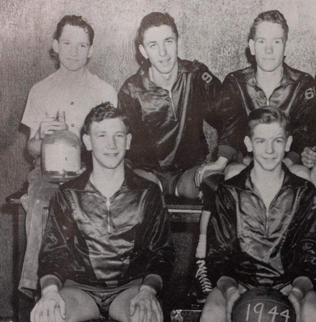 A photograph from the 1944 Emporia High yearbook, shows a young Dean Smith, who would’ve been about 12 or 13, holding a glass water jug — perhaps a sign that he might’ve been the Spartans’ waterboy that season. 