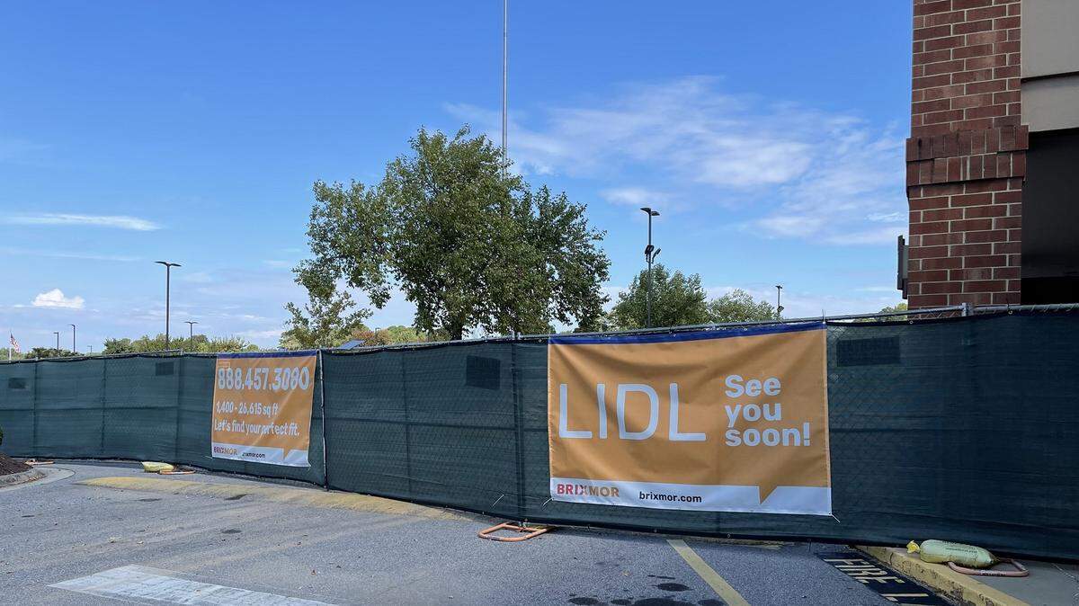 A sign on a construction fence surrounding the former Kroger at 2680 Timber Drive announces Garner’s first Lidl grocery location.