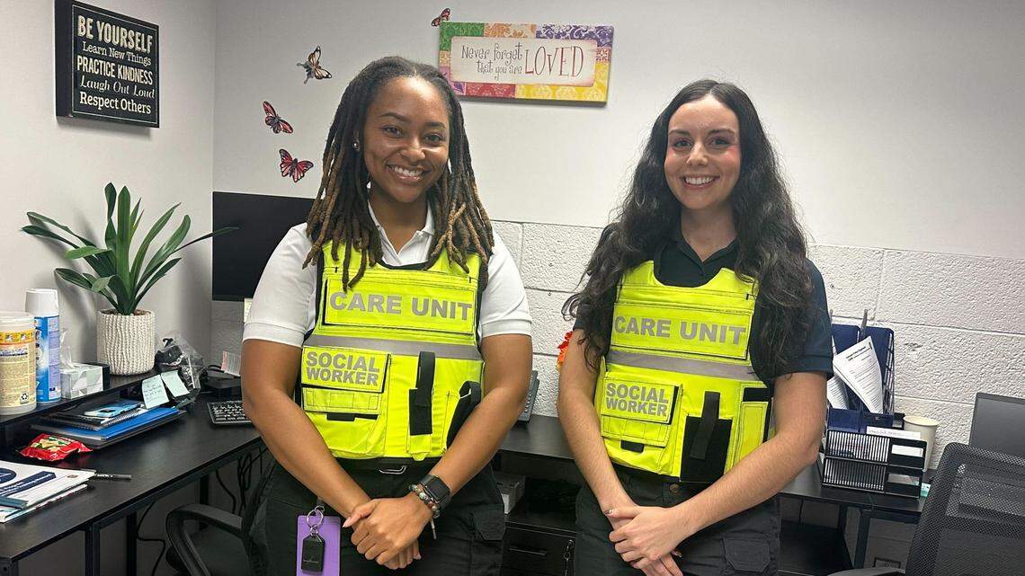 Kayla Hawkins, 27, left, and Sarah Jump, 24, right, stand in their office at the Zebulon Police Department on Sept. 25, 2024. Hawkins and Jump serve as social work interns in the department’s CARE unit.