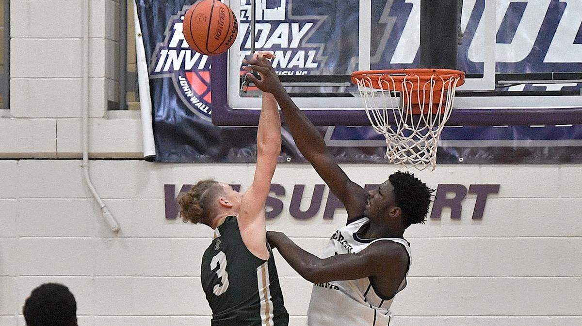 Reidsville’s Kendre Harrison (0) blocks the shot from Northwood’s Isaiah Blair (3) during the second half of their game in the John Wall Holiday Invitational. The Northwood Chargers and the Reidsville Rams met in a final of the John Wall Holiday Invitational in Raleigh, N.C. on December 30, 2023.