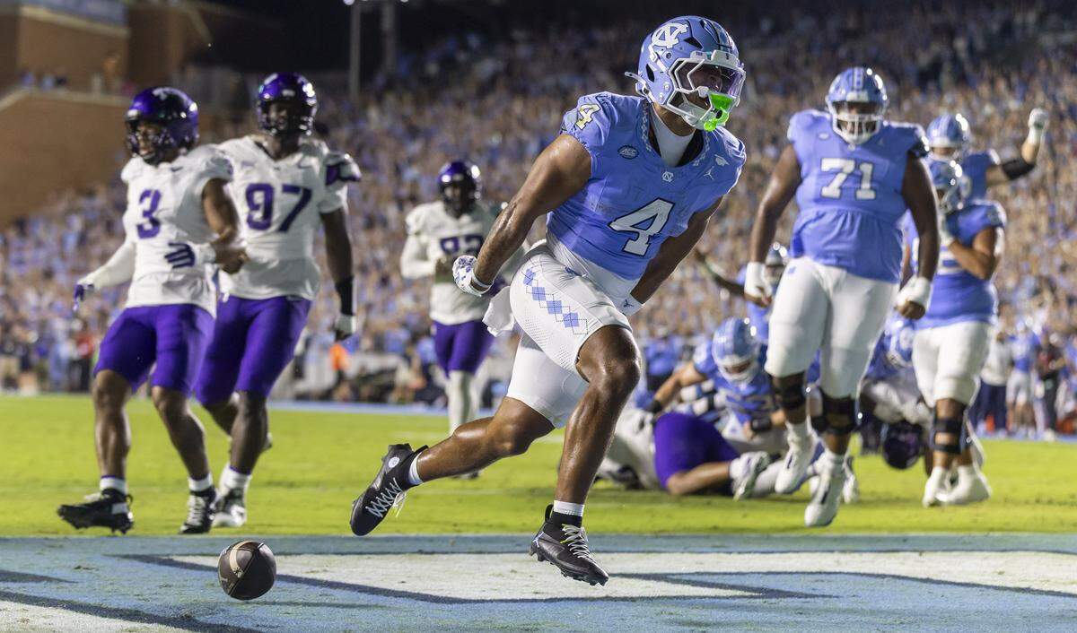 North Carolina running back Caleb Hood (4) reacts after scoring a touchdown on an eight yard run in the first quarter to take a 7-0 lead over TCU on Monday, September 1, 2025 at Kenan Stadium in Chapel Hill, N.C. 