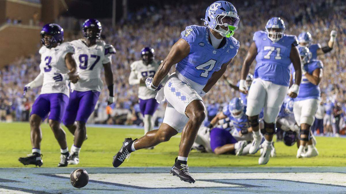 North Carolina running back Caleb Hood (4) reacts after scoring a touchdown on an eight yard run in the first quarter to take a 7-0 lead over TCU on Monday, September 1, 2025 at Kenan Stadium in Chapel Hill, N.C.