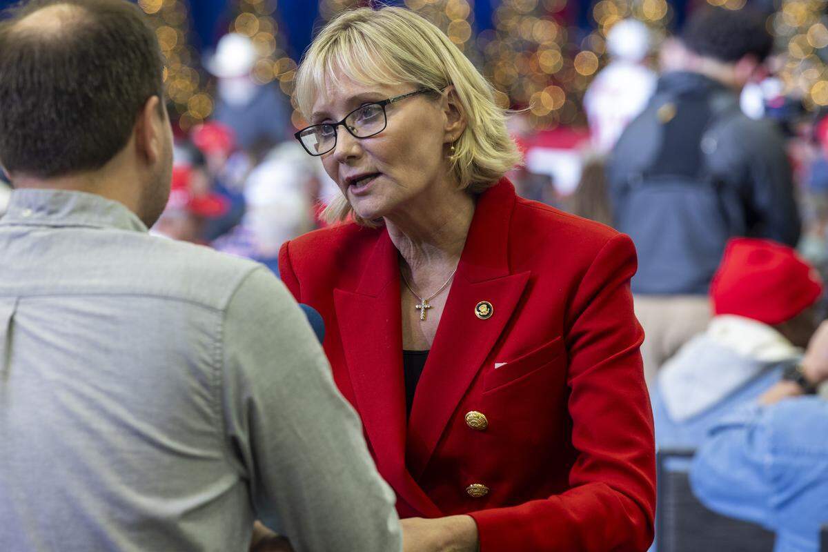 Republican Laurie Buckhout, who is running in a crowded primary to challenge incumbent Democratic U.S. Rep. Don Davis in the 1st District, talks with a reporter before a rally featuring President Donald Trump at the Rocky Mount Event Center on Friday, Dec. 19, 2025.