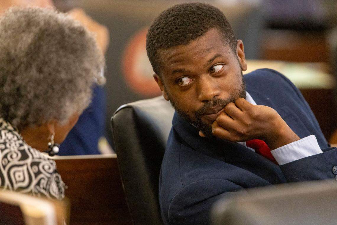 Rep. Cecil Brockton talks with Rep. Evelyn Terry during debate on sports betting on Wednesday, June 22, 2022 at the General Assembly in Raleigh, N.C.