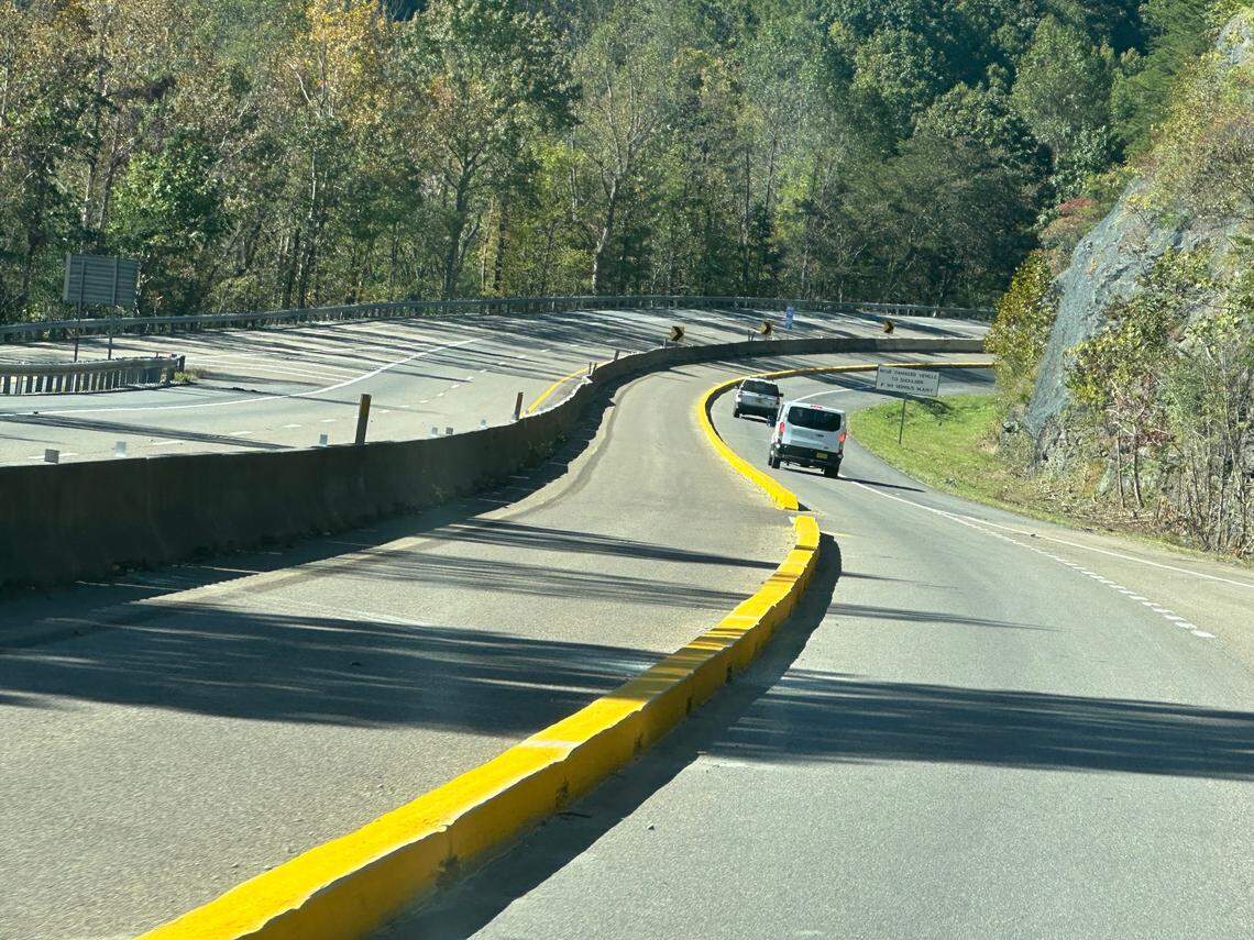 The Tennessee Department of Transportation built a yellow concrete median barrier on the westbound lanes of Interstate 40 this fall, in anticipation of the reopening the highway to two-way traffic while the eastbound lanes are rebuilt. The final median also has reflective posts. The N.C. Department of Transportation is building the same barrier on its side of the state line.