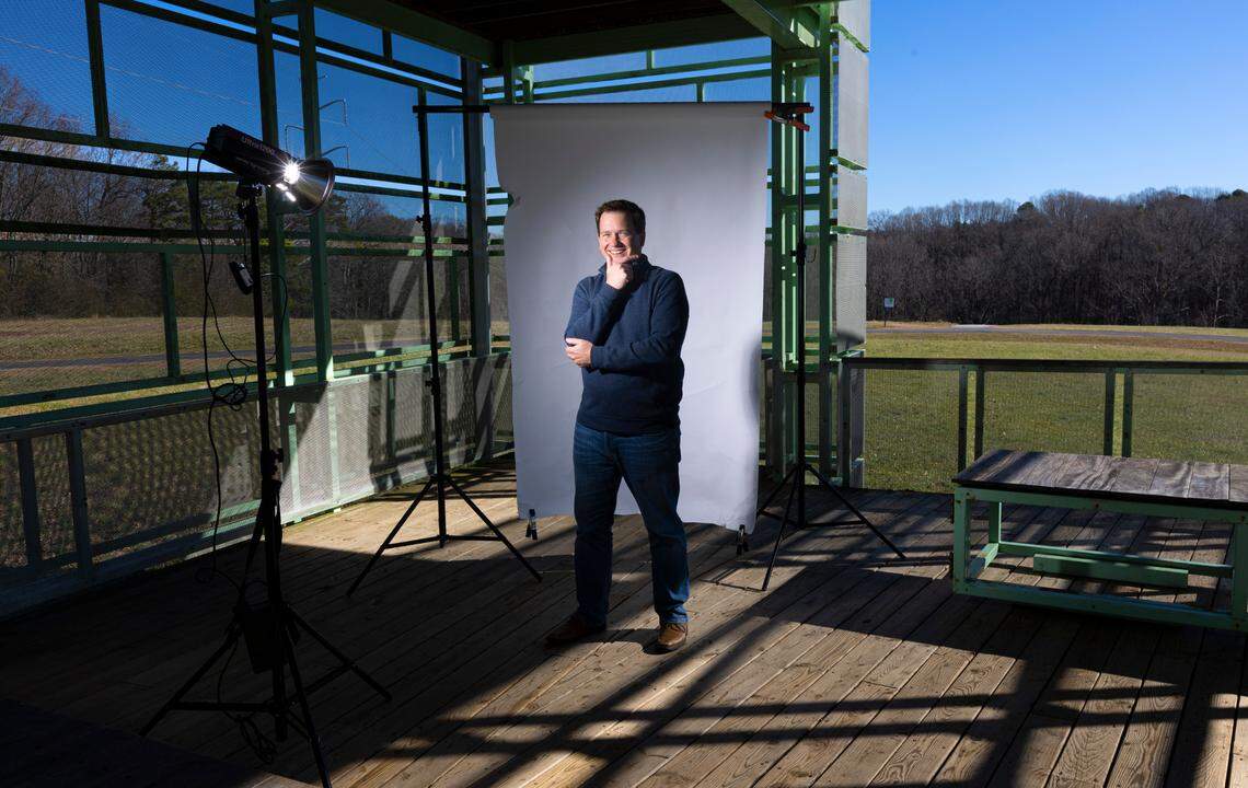John Huisman, who is the @triangleexplorer on Instagram, poses in the Lowe’s Park Pavilion at the North Carolina Museum of Art in Raleigh, N.C., Friday, Jan. 6, 2023.