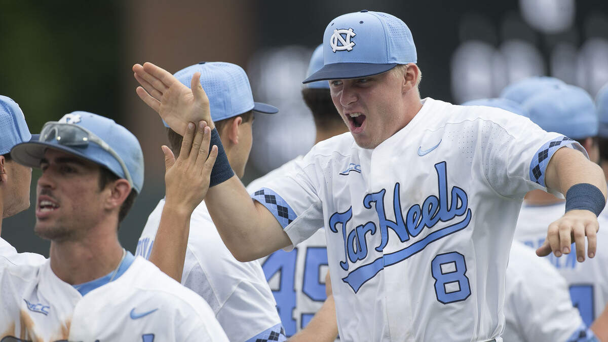UNC coach Mike Fox calls shortstop Ike Freeman, right, the team MVP.