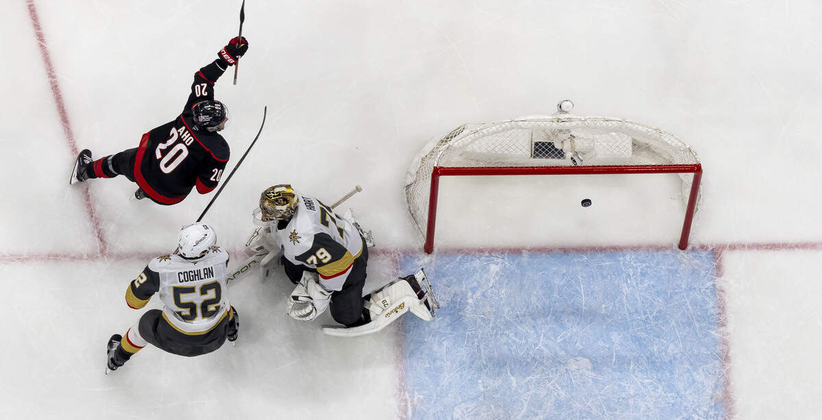 Carolina Hurricanes center Sebastian Aho (20) scores on Vegas goalie Carter Hart (79) to take 3-1 lead in the second period, during Game 5 of the Stanley Cup Final against Vegas, on Thursday, June 11, 2026 at Lenovo Center in Raleigh, N.C.