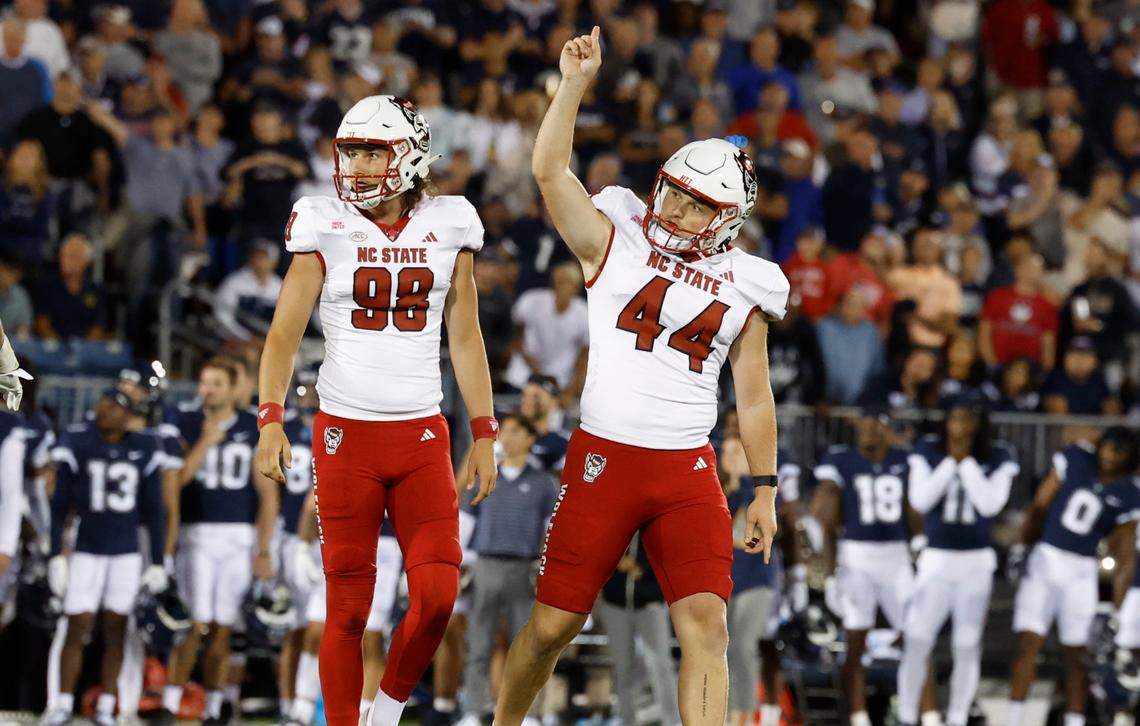 N.C. State’s Brayden Narveson (44) celebrates after hitting a 44-yard field goal during the first half of the Wolfpack’s game against UConn at Rentschler Field in East Hartford, Conn. Thursday, August 31, 2023. N.C. State’s Caden Noonkester (98) stands to the left.