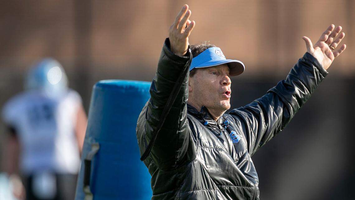 North Carolina assistant head coach for defense, Gene Chizik, works with players during the opening day of the Tar Heels’ spring football practice on Tuesday, March 1, 2022 in Chapel Hill, N.C.