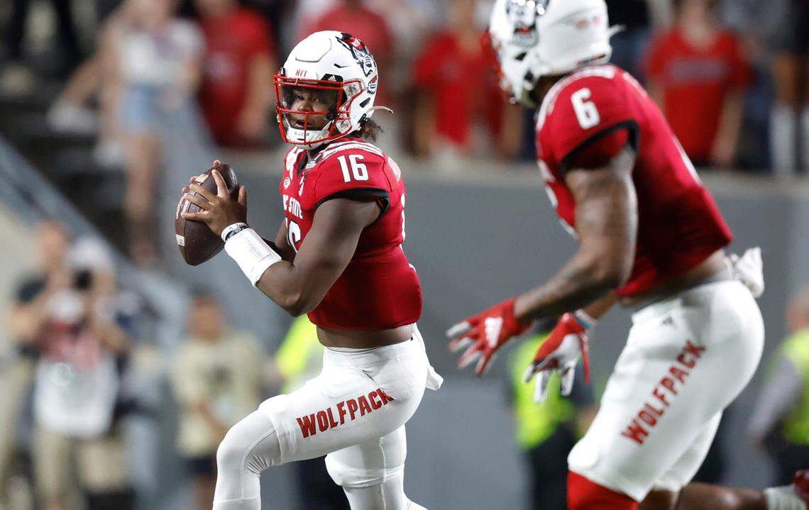 N.C. State quarterback MJ Morris (16) looks for a receiver downfield during the first half of N.C. State’s game against Wake Forest at Carter-Finley Stadium in Raleigh, N.C., Saturday, Nov. 5, 2022.