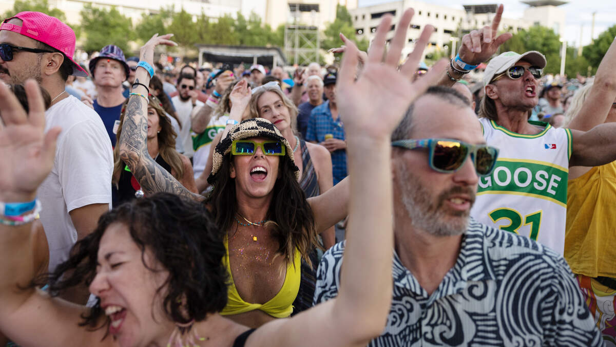 Fans of the jam band Goose dance in the pit at the band’s Friday show at Red Hat Amphitheater.