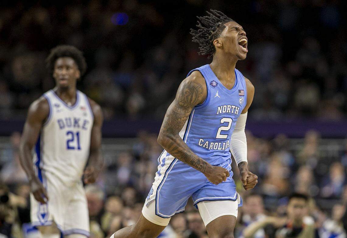 North Carolinas Caleb Love (2) reacts after sinking a basket to cut the Duke lead to two points late in the first half during the NCAA Final Four semi-final on Saturday, April 2, 2022 at Caesars Superdome in New Orleans, La.