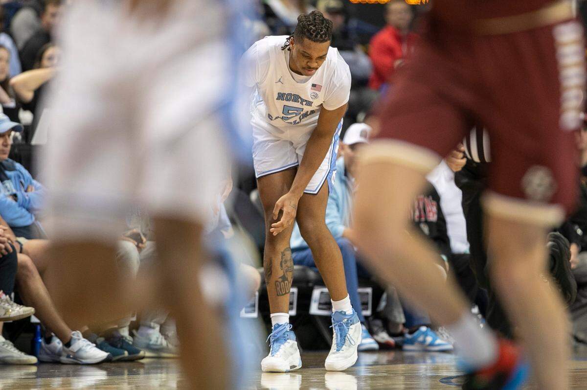North Carolina’s Armando Bacot (5) hobbles to his feet after injuring himself in the first half against Boston College in the second round of the ACC Tournament on Wednesday, March 8, 2023 at the Greensboro Coliseum in Greensboro, N.C.