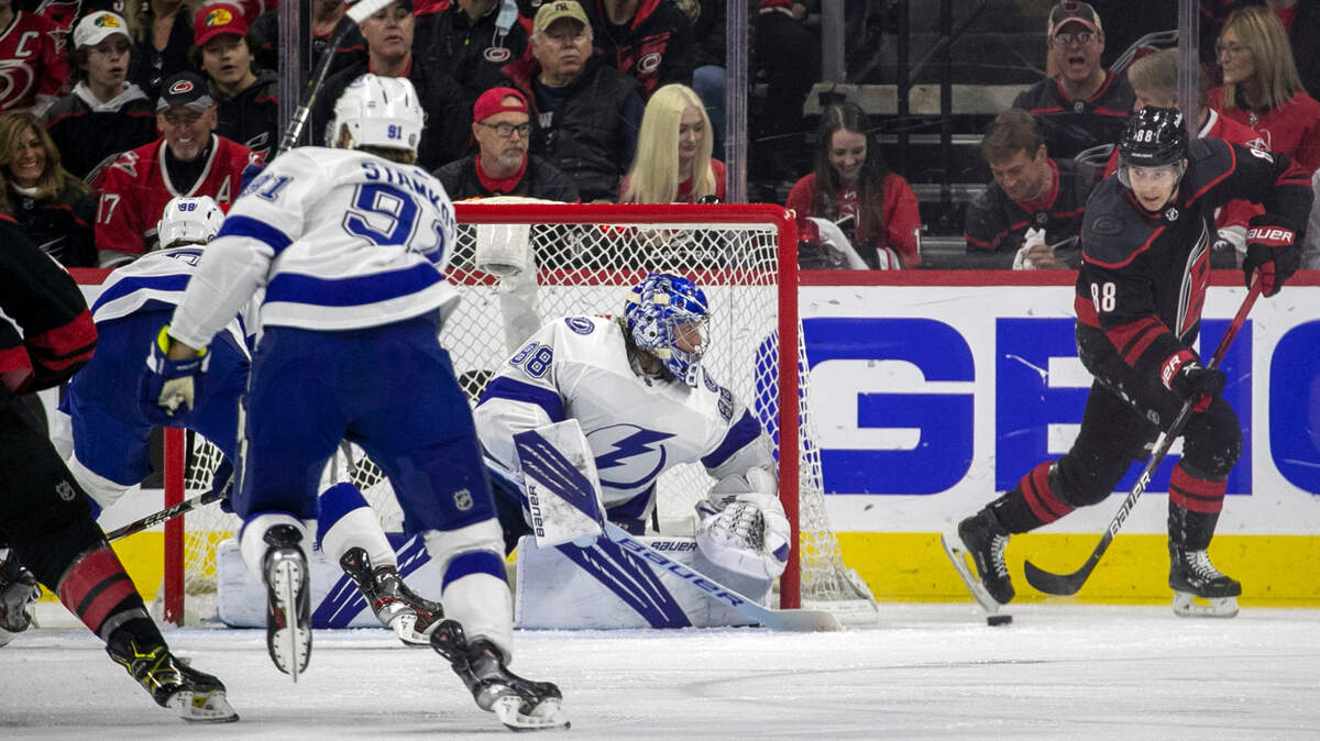 Carolina Hurricanes’ Martin Necas (88) works the puck behind Tampa Bay goalie Andrei Vasilevskiy (88) in the first period during game one of their second round Stanley Cup series on Sunday, May 30, 2021 at PNC Arena in Raleigh, N.C.