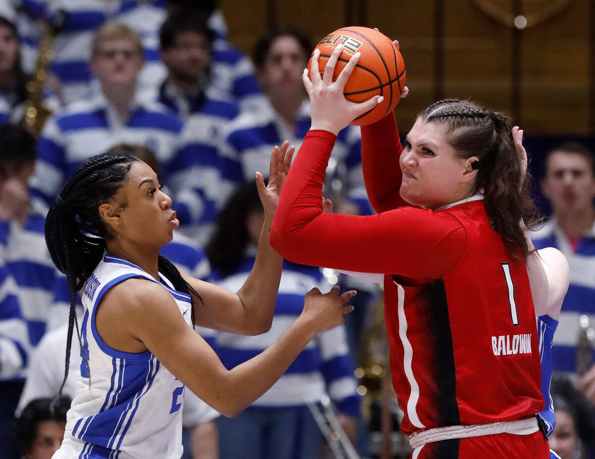 N.C. State’s River Baldwin is pressured by Duke’s Reigan Richardson during the second half of the Wolfpack’s 69-58 loss on Sunday, Feb. 25, 2024, at Cameron Indoor Stadium in Durham, N.C.