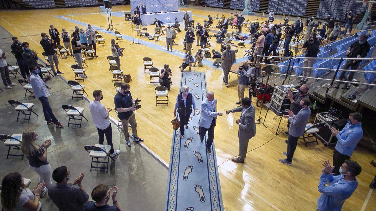 North Carolina coach Roy Williams leaves the Smith Center with his wife Wanda, after announcing his retirement from coaching on Thursday, April 1, 2021 in Chapel Hill, N.C.  Williams has coached for 33 seasons, the last 18 at North Carolina, winning the National Championship in 2005, 2009, and 2017.
