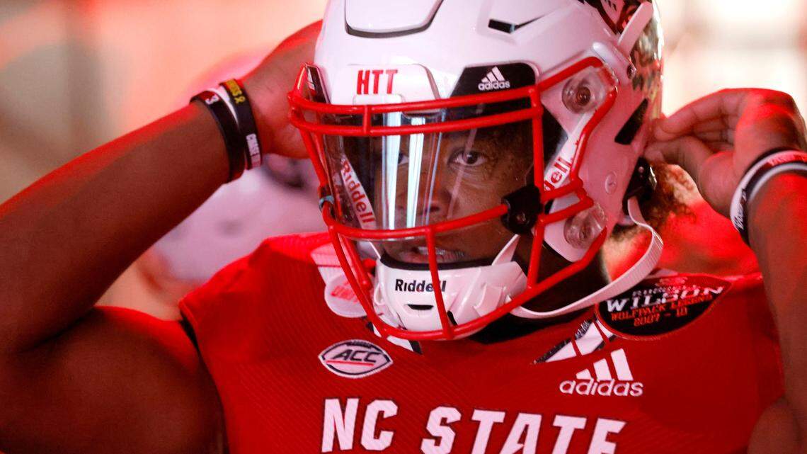 N.C. State quarterback MJ Morris (16) gets ready to head out onto the field before N.C. State’s game against Wake Forest at Carter-Finley Stadium in Raleigh, N.C., Saturday, Nov. 5, 2022.